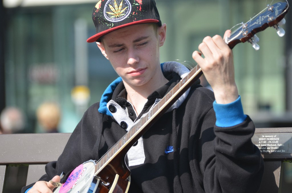 A boy playing the banjo in George Square, Glasgow, after the Scottish independence referendum.