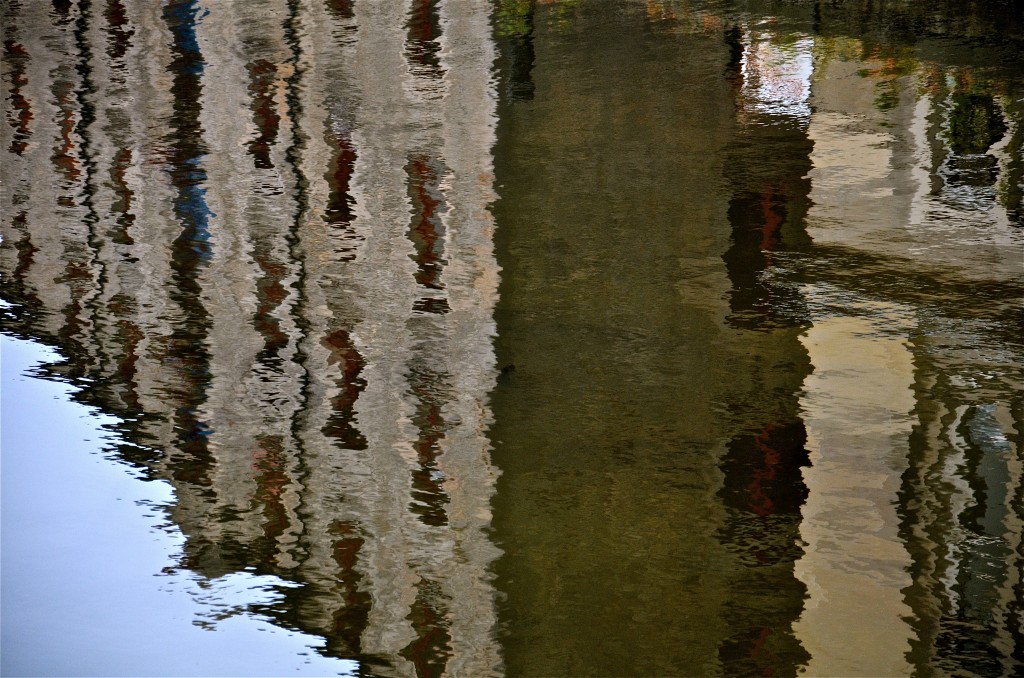 Reflections of tenements in Water of Leith, Ediburgh